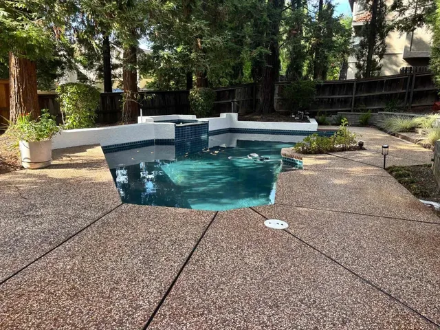 Pool surround with painted fencing and decking